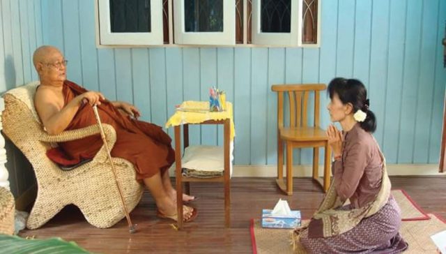 Aung San Suu Kyi pays her respects to Sayadaw U Pandita at his meditation center, Panditarama, 2013.