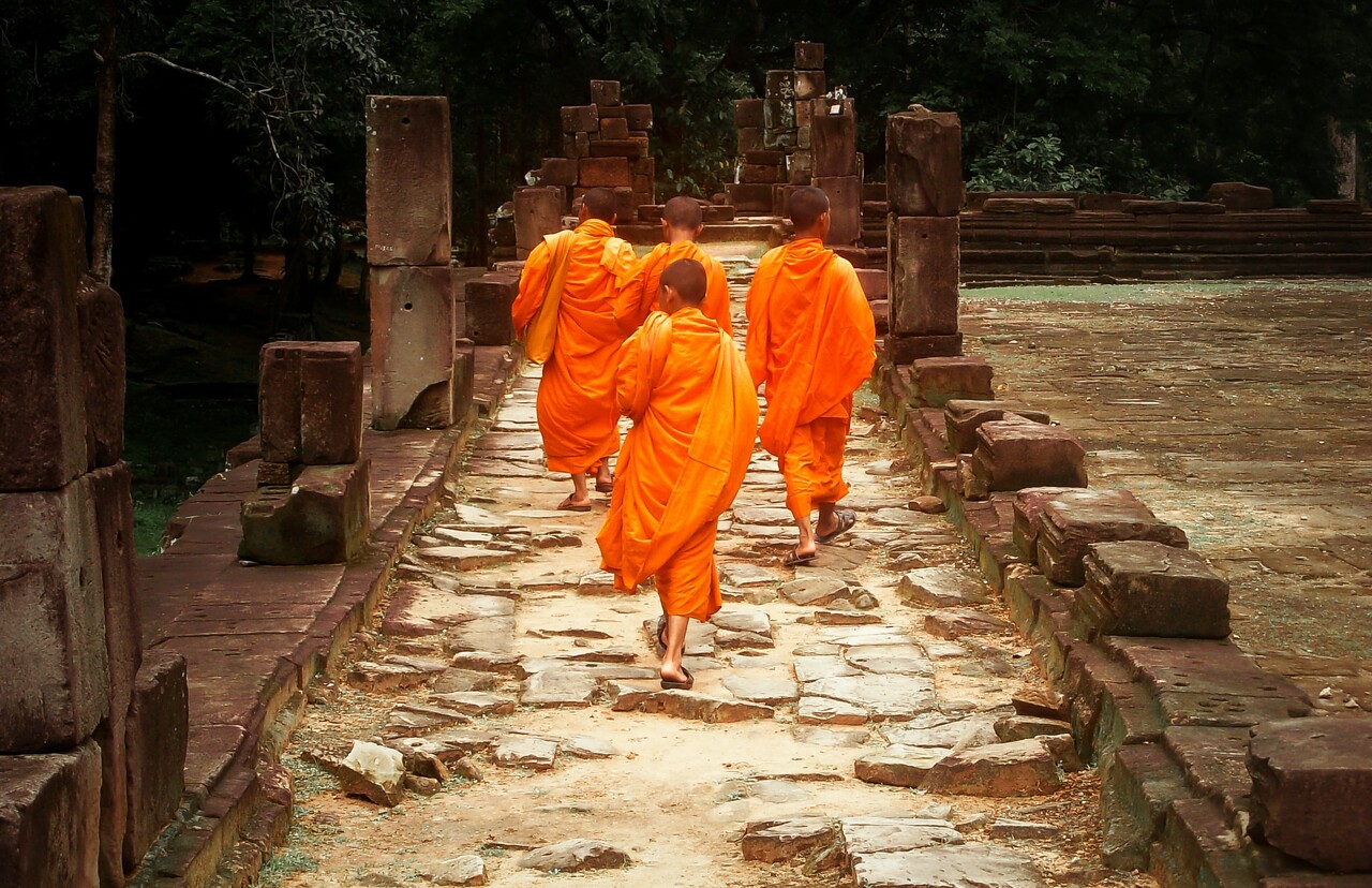 Buddhist monks inside Baphuon temple, Siem Reap, Cambodia