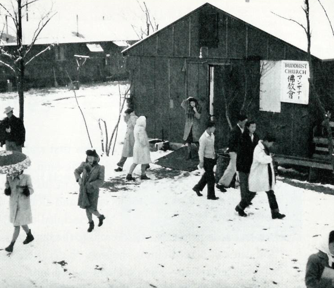 Japanese Americans leaving a Buddhist church at the Manzanar internment camp in Montana during World War II. Ansel Adams/ From Manzanar by John Armor and Peter Wright, Random House.