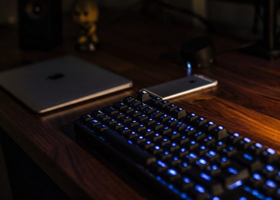 a lit keyboard in a dark office for a story on corporate practice