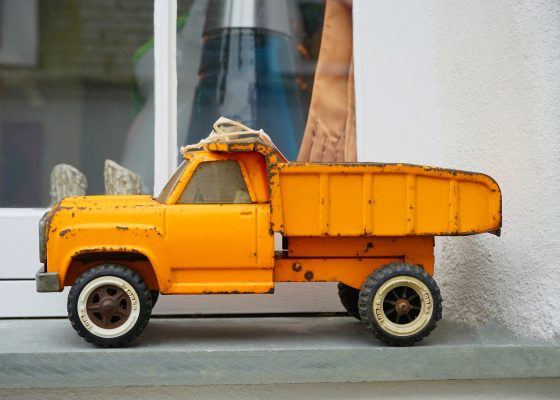 a yellow toy truck for story on karma for kids