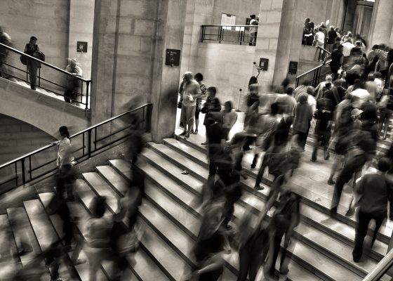People rushing on stairs, do less accomplish more
