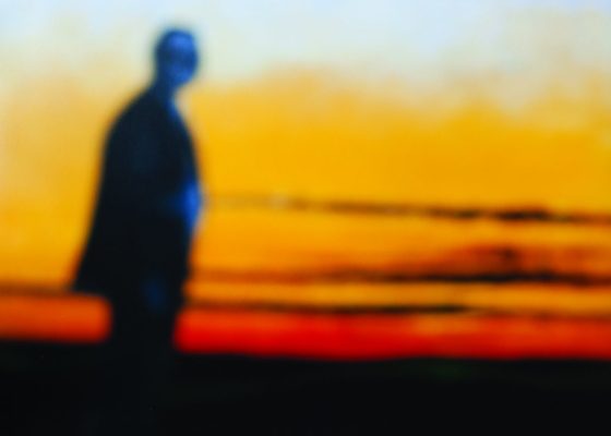 blurry figure against sunset for story about meditating with emotions