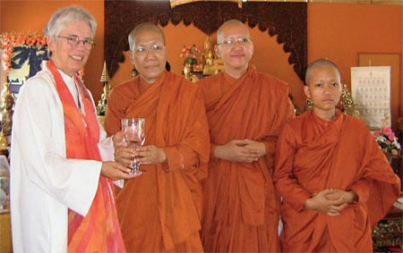 Victoria Rue, a Roman Catholic woman priest, presents an engraved crystal chalice to Dhammananda, Thailand's first ordained Theravada nun