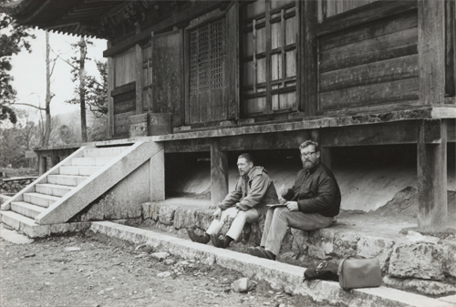 Gary Snyder and Philip Whalen sit outside a temple above the village of Shimoyama in Japan, photograph courtesy of the Brancroft Library, University of California, Berkeley. Banc pic 2003.218--pic box 1