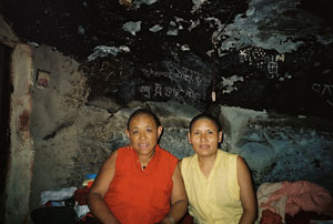  Ani Choenyi (left) and Ani Choe Lhamo in Ani Choenyi's cave, © Kate Wheeler
