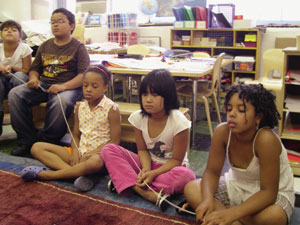  Third and fourth graders meditate at NYC's East Village Community School © Elaine Chu 
