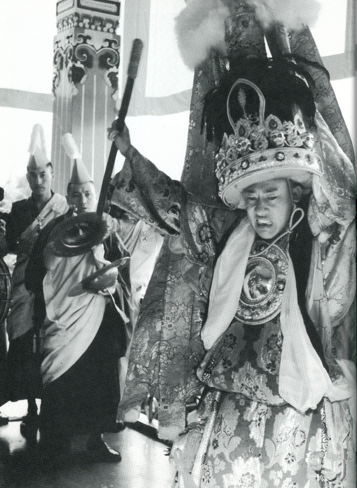 Thupten Ngodrup, the Nechung Oracle, goes into trance. "The Oracle's eyes begin to twitch, his mouth opens, and he starts shaking." Copyright Anna Kelden, Courtesy The Nechung Foundation, New York.
