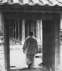 A monk walks through a gate inside Ch'ondeung-sa, the temple where the blocks were carved. Courtesy of Robert Young. 