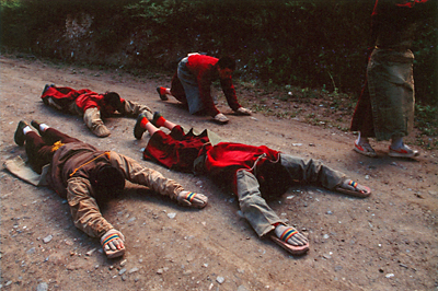 [Group of devotees prostrating themselves on their way to Lhasa, Tibet. It will take them two years to get there.]