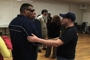 Jesse Acosta (left), blinded by shrapnel in Iraq, shakes hands with fellow Iraq veteran Jeremy Williams at the Coming Home Project retreat in Berkeley. 