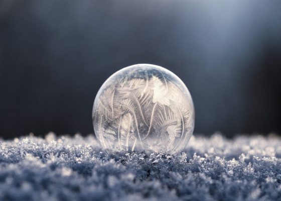 image of frozen bubble in snow for story about hope in a dark december