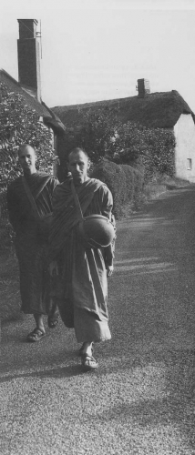 Monks making their daily alms-round through the English village of West Sussex. Courtesy of the Chithurst Buddhist Monastery.
