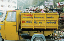  A Bodh Gaya garbage truck overflows with trash from the town's growing business of pilgrimage. © Liesl Schwabe 