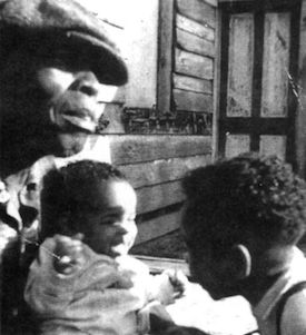 Image 5: Grandfather Baba James holding author's younger brother, Jimmy, while Ralph, three-and-a-half, looks on. This is the home where both boys were born. The author's family has administered a Methodist Church on Pawleys Island since 1850. Male deacons are titled "Baba" and females, "Sister."