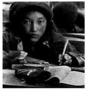 Image 4: A Tibetan girl practicing calligraphy. Courtesy Phil Borges.