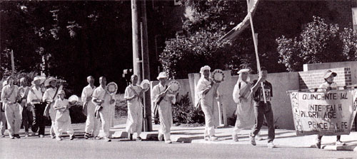 Members of the Nippon Myohoji walking, chanting, and fasting for peace.