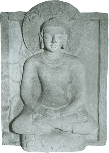 a stone buddha sitting in meditation