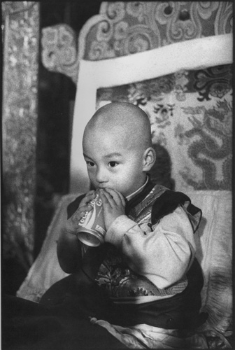 Martine Franck, The new reincarnation of Kalu Rinpoche at his enthronement ceremony, Sonada monastery, near Darjeeling, India, 1993.