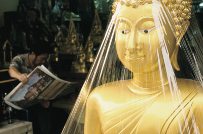 A new Buddha statue on Bamrung Muang Street in Bangkok, Thailand © Alison Wright