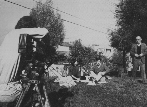 Left to Right: Lou Hawthorne (with camera), Anne Cushman (seated aat left), with a ZCLA practitioner and Maezumi Roshi (standing); © Craig Feder