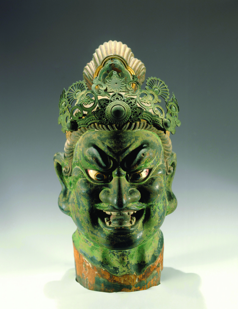 Head of a Guardian King, Kamakura period, 13th century. Polychromed Japanese cypress (hinoki) with lacquer on cloth, inlaid rock crystal eyes, and filigree metal crown. 22 1/6 x 10 1/4 x 13 15/16 in. Brooklyn Museum, gift of Mr. and Mrs. Alastair B. Martin, the Guennol Collection.