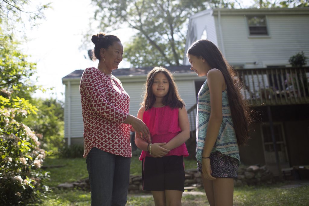 lhakpa sherpa and her daughters in a backyard in Connecticut