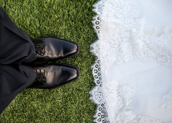 mindful wedding photo, close up of bride and groom feet