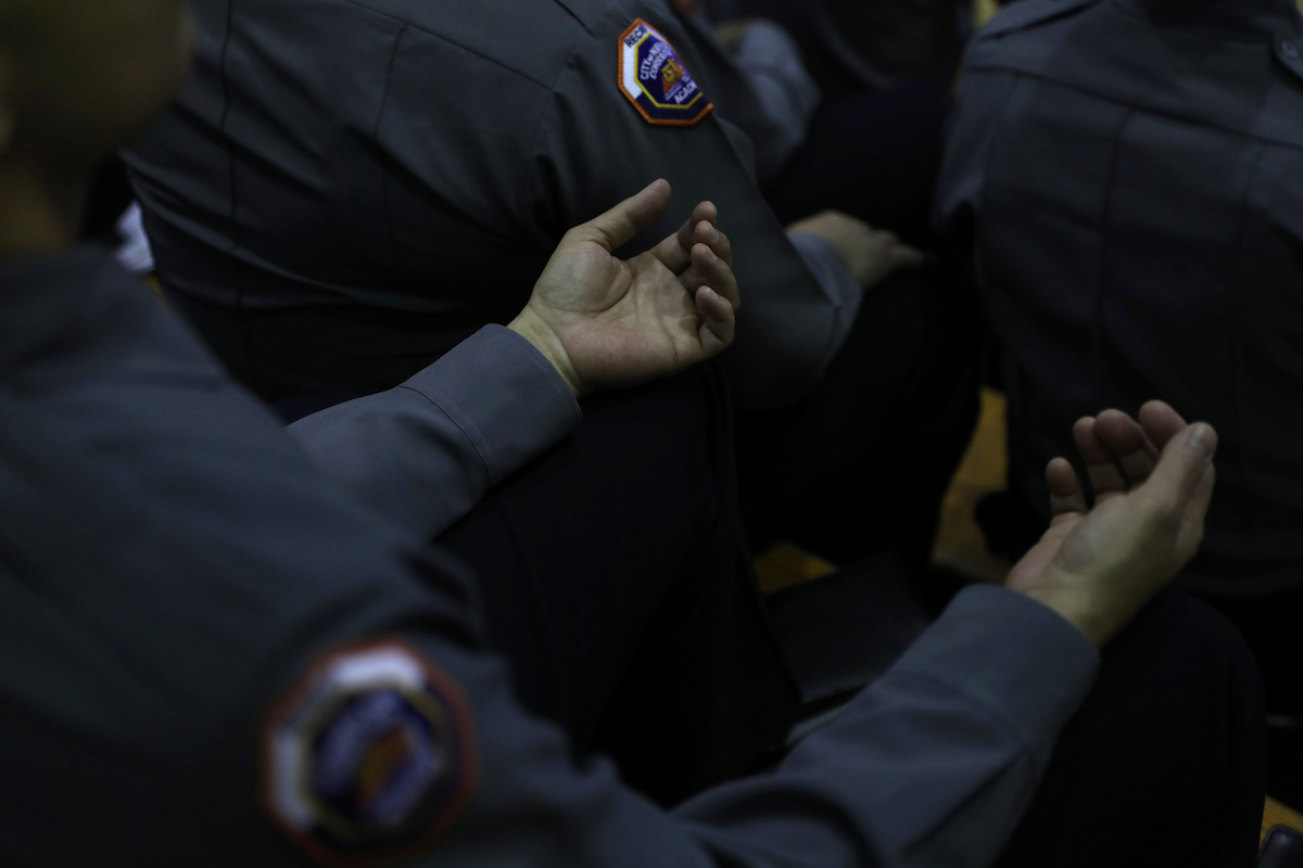 Officers meditate during a class on Rikers Island