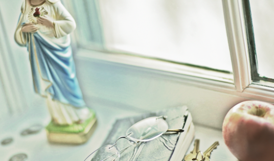 Christian statue on window ledge for story about buddhism and christianity in the bible belt
