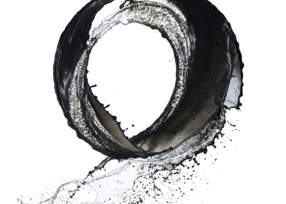 Black circle of liquid on white background, emptiness in buddhism