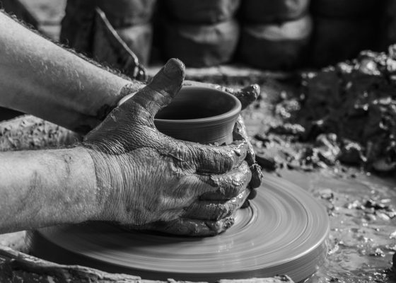 Potter forming clay into pots lojong