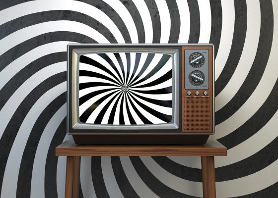 Photo of television with swirling graphic on screen and in background