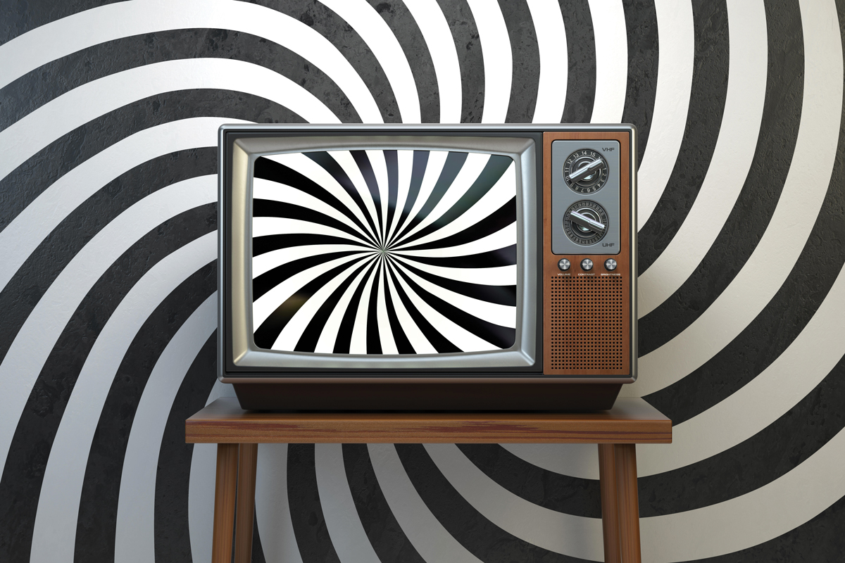 Photo of television with swirling graphic on screen and in background