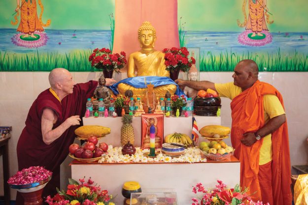 venerable karma lekshe tsomo arranging an altar at an ambedkarite buddhist temple