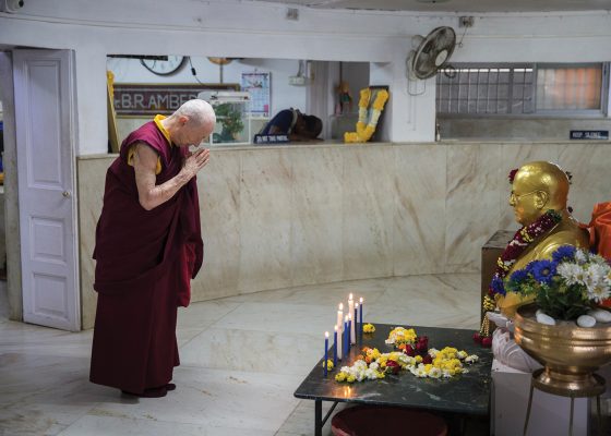 Venerable Karma Lekshe Tsomo bowing to a statue of Ambedkar at Chaityabhumi Stupa