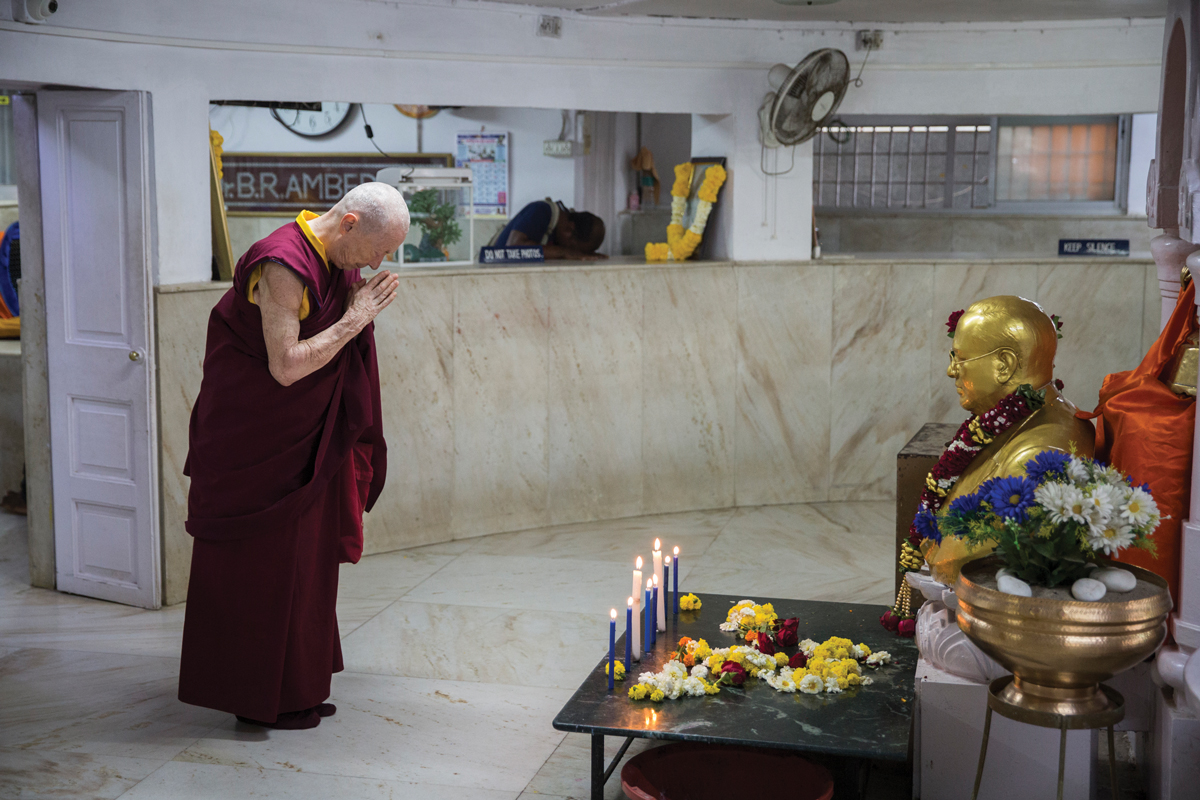 Venerable Karma Lekshe Tsomo bowing to a statue of Ambedkar at Chaityabhumi Stupa