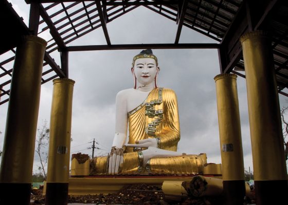 photo of giant buddha statue and building structure