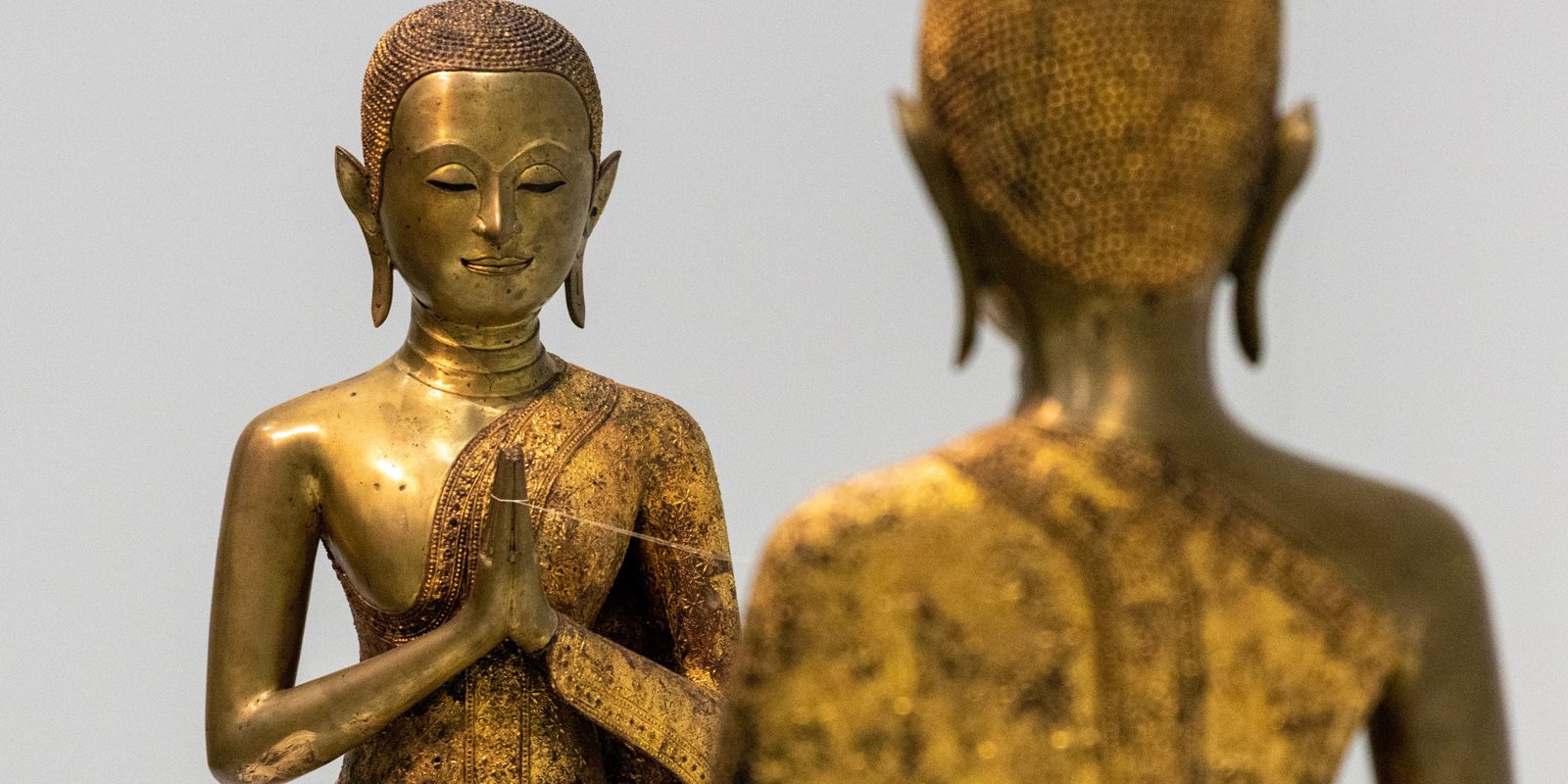 two buddha statues | transgender buddhist
