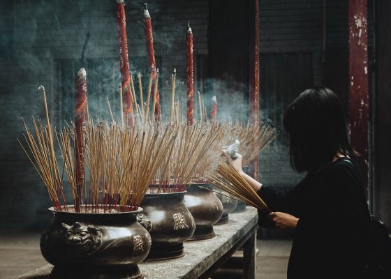 Woman offering incense in ritual, letter to the editor fall 2019