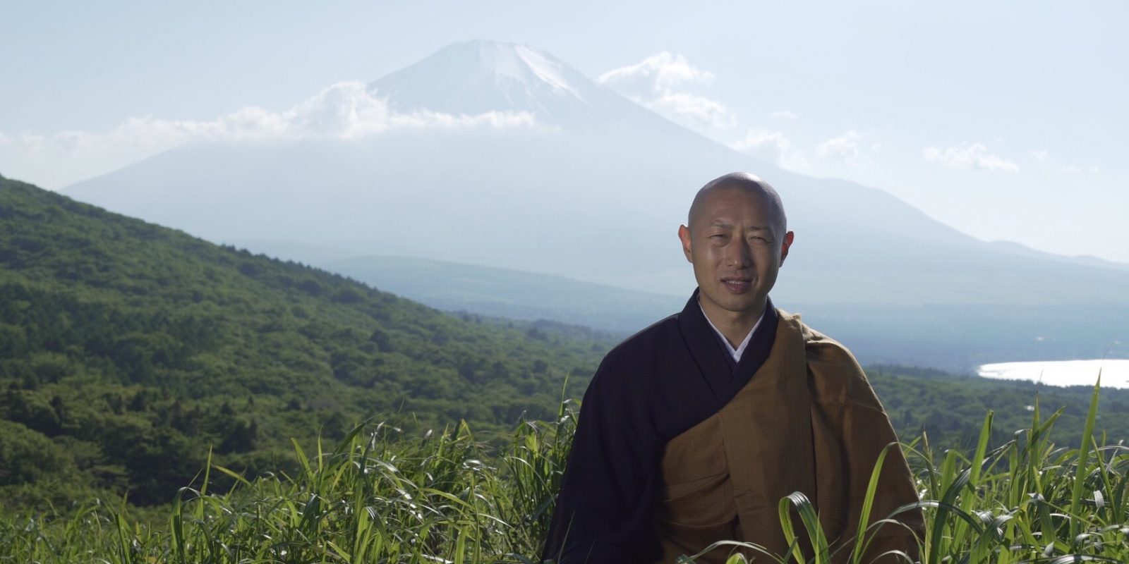 the monk chiken in front of mount fuji in the film tenzo