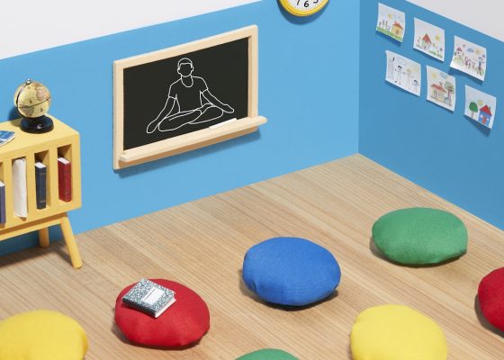 A photograph by artist Margeaux Walter that depicts colorful meditation cushions in a classroom suggesting mindfulness being taught to children