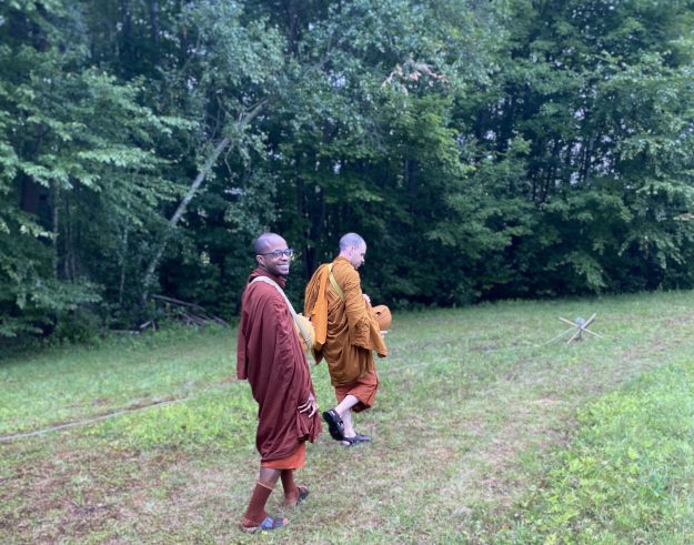 Tahn Pamutto and Bradley Donaldson walk for alms.