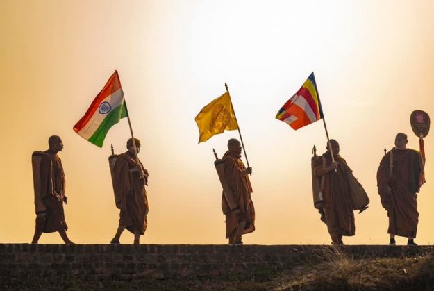 Monks carry flags at the International Tipitaka Chanting Ceremony.