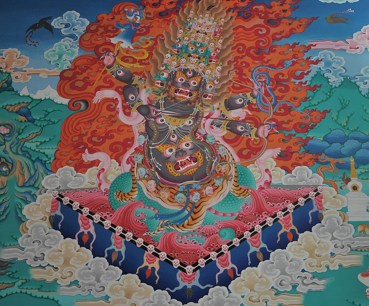 painting of Rahula, wrathful deity, with face on stomach, lower body of serpent, and a thousand eyes, vajrayana buddhism