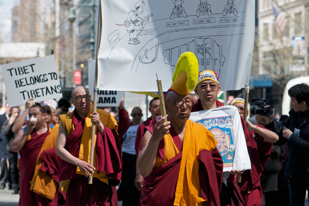 Tibetan monks protesting, modern buddhism