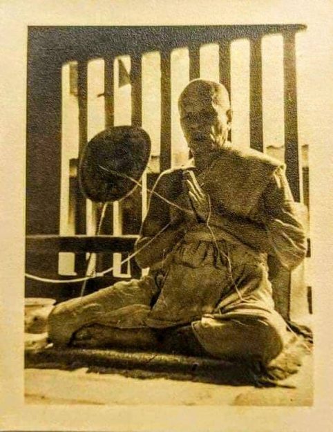 Luang Pho Sot chanting a text after the meal.